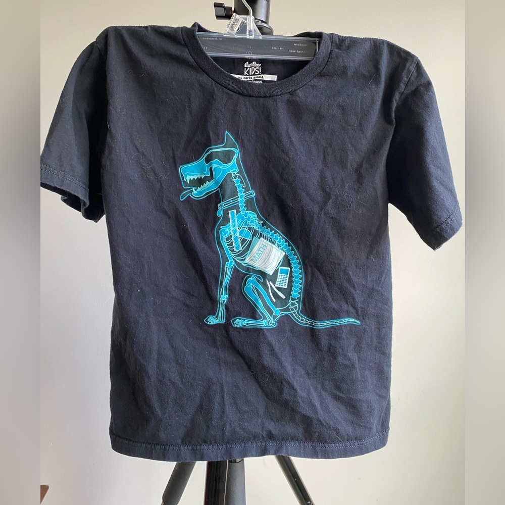 Threadless brand black t-shirt with graphic "Homework Evidence"